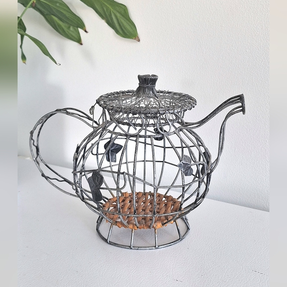 Wire teapot with a rattan base